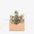 Christmas tree symbol in craft envelope on white background. Royalty Free Stock Photo