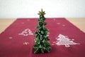 Christmas tree on a textured fabric with a white background Royalty Free Stock Photo