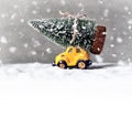 Christmas tree on toy car. Christmas holiday celebration concept Royalty Free Stock Photo