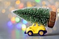 Christmas tree on toy car. Christmas holiday celebration concept Royalty Free Stock Photo