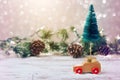 Christmas tree on toy car over festive background. Christmas holiday celebration Royalty Free Stock Photo