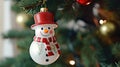 Christmas tree toy in the form of a snowman in a red hat Royalty Free Stock Photo