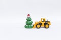 Christmas tree toy with front loader truck on white background Royalty Free Stock Photo