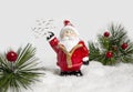 Christmas tree toy santa claus with gifts on a blurry background. Santa Claus is holding a snowflake. Christmas card Royalty Free Stock Photo