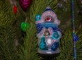 Snowman Christmas tree toy on the new year green tree