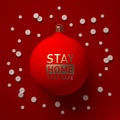 Christmas tree toy with STAY HOME, STAY SAFE inscription on a red background with a lot of pills looking like snowflakes. Royalty Free Stock Photo