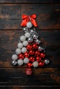 Christmas tree from toys concept, on old dark  wooden table background, top view flat lay Royalty Free Stock Photo