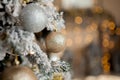 Christmas tree with toys and decorative snow for a happy new year on background of bokee Royalty Free Stock Photo