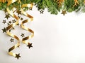 Christmas tree toys, golden stars and fir branch on a white background. Christmas decorations. Greetings card.