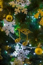 Christmas tree toys hanging on christmas tree - musical notes, snowflakes, balls, beads, garlands. Christmas Royalty Free Stock Photo