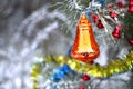 Christmas tree toys on a natural branch with pine tree needles on the snow background in forest. Concept of Christmas, New Year Royalty Free Stock Photo