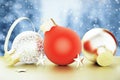 Christmas tree toys - red and gold balls and stars at winter weather background Royalty Free Stock Photo