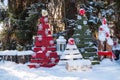 Christmas tree with toys and sled in the city Park. Decorated tree outside with lights covered with snow. A clear winter Royalty Free Stock Photo