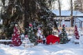 Christmas tree with toys and sled in the city Park. Decorated tree outside with lights covered with snow. A clear winter Royalty Free Stock Photo