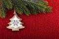 Christmas tree traditional decoration on red wool background Royalty Free Stock Photo