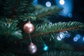 a christmas tree with two ornaments hanging from it Royalty Free Stock Photo