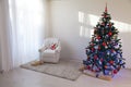 Christmas tree in a white room for Christmas with gifts