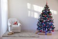 Christmas tree in a white room for Christmas with gifts