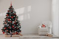 Christmas tree in a white room for Christmas with gifts