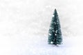 Christmas tree on white snow, light bokeh backgrounds ,Merry Christmas and happy New Year Royalty Free Stock Photo