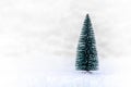 Christmas tree on white snow, light bokeh backgrounds ,Merry Christmas and happy New Year Royalty Free Stock Photo