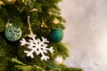 Christmas tree with wood snowflake and colourful balls decoration on gray background, copy space Royalty Free Stock Photo