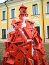 Christmas tree from wooden birdhouses. Festival of creative Christmas trees on Metallistov street