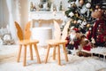 christmas tree and wreath, stars, gifts and decoration. Family time photo corner.