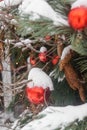 Christmas trees decorated with red balloons in front of the cafe entrance. Street Christmas decorations.