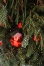 Christmas trees decorated with red balloons in front of the cafe entrance. Street Christmas decorations.