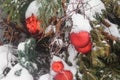 Christmas trees decorated with red balloons in front of the cafe entrance. Street Christmas decorations.