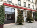 Christmas trees flank entrance of Les Dames du Pantheon hotel in Paris, France