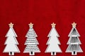 Christmas trees on red plush material holiday background