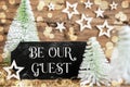 Christmas Trees, Rustic Holiday Background With Sign With Text Be Our Guest
