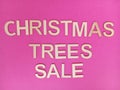 Christmas trees sale message on a pink background Royalty Free Stock Photo