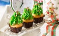 Christmas trees shape capcakes for festive breakfast. Royalty Free Stock Photo