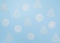 Christmas trees and snowflakes on a sky-blue background. The view from the top Royalty Free Stock Photo