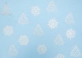 Christmas trees and snowflakes on a sky-blue background. The view from the top Royalty Free Stock Photo