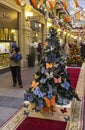 Christmas trees with symbols of various companies in GUM. Moscow, Russia Royalty Free Stock Photo