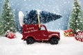 Christmas truck with green firtree on the roof with a winterly szenary with message im driving home for christmas