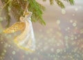 Christmas trumpet angel toy on Christmas tree branch on white background with lights