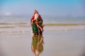 Christmas vacation background. Santa Claus on sea beach. Happy New Year and merry Christmas travel, tropical vacations Royalty Free Stock Photo