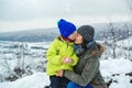 Christmas vacation. Happy family and childhood. Mother and child on snowy winter walk Royalty Free Stock Photo