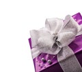 Christmas or Valentine's purple gift with silver ribbon. Royalty Free Stock Photo