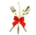 Christmas and Valentines table. Gold cutlery tied with red ribbon bow isolated on white