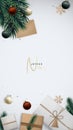 Christmas vertical template with gift boxes, fir tree branches, shiny balls and golden snowflakes. Royalty Free Stock Photo