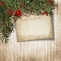 Christmas vintage background with holly, firtree and grunge postcard. Greeting card with copy space