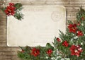 Christmas vintage card with poinsettia, holly and fir branches Royalty Free Stock Photo