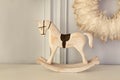 Christmas, Vintage figurine rocking horse. Carved wooden horse figurine. Decorative figurines of a Xmas theme. Royalty Free Stock Photo