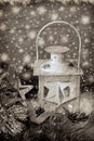 Christmas vintage lantern in snowy night in sepia